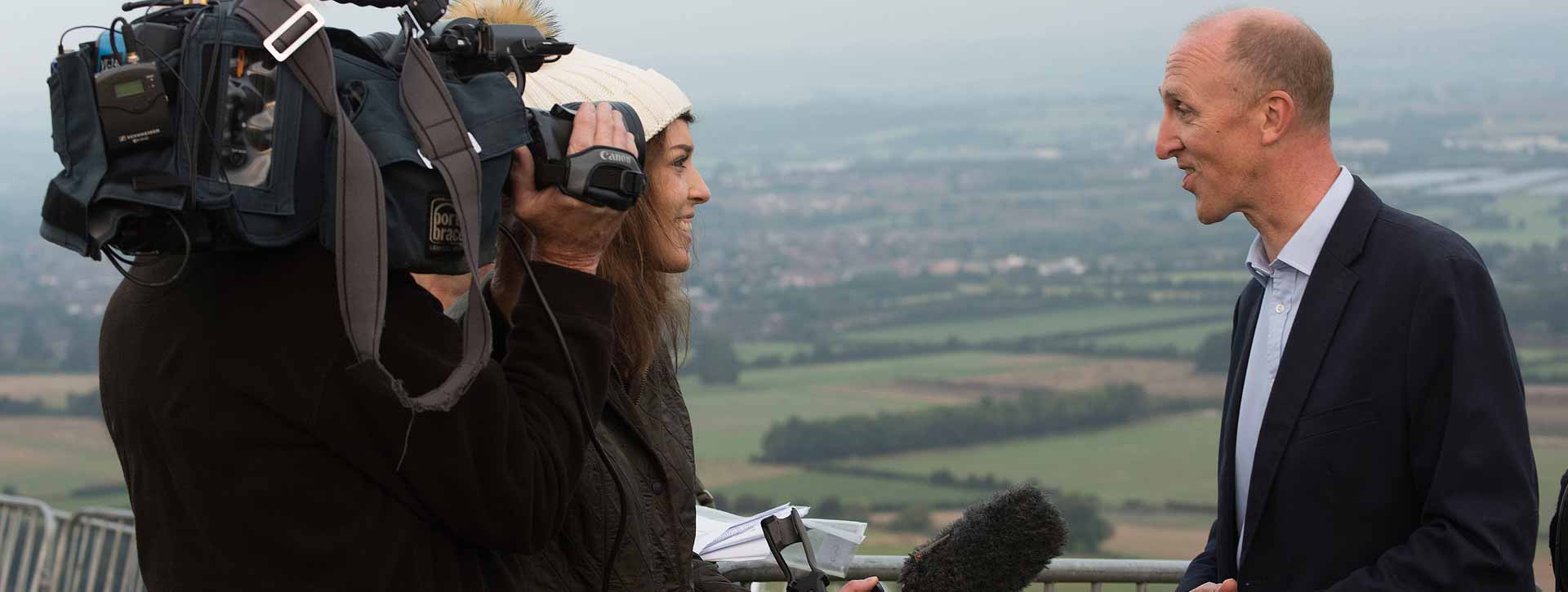 image of presenter interviewing a corporate executive