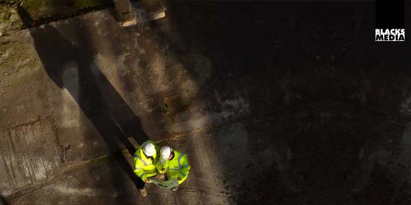 Corporate photography aerial view of employee working group on site
